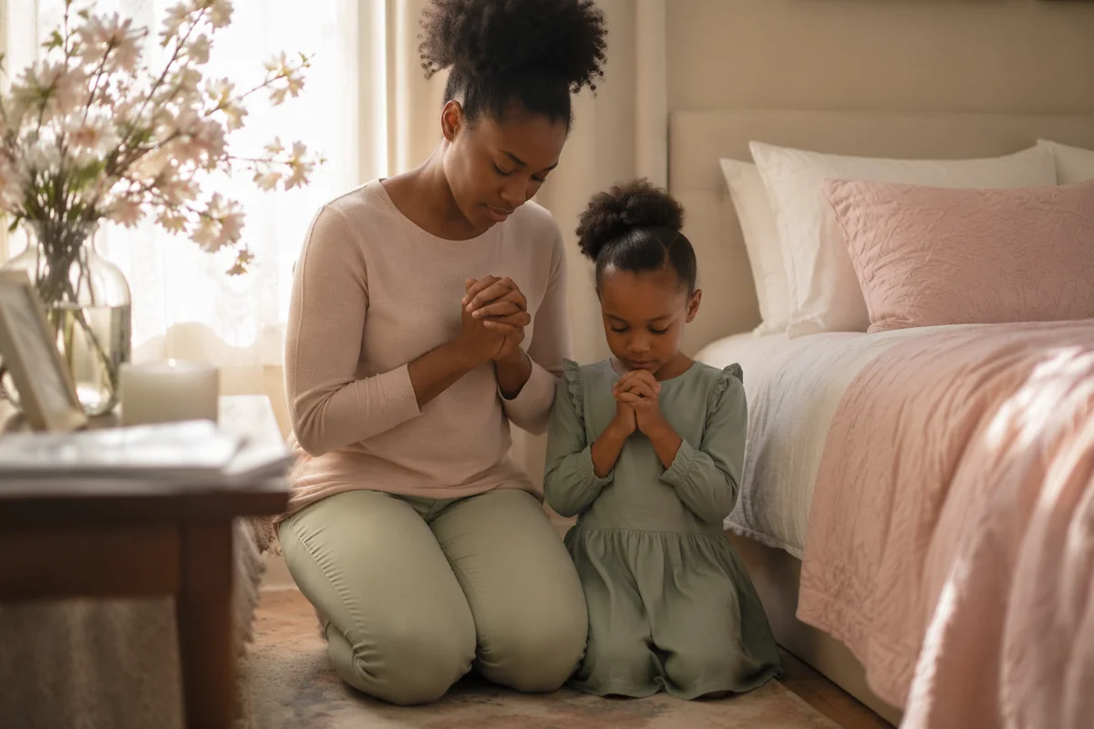 Mother and Daughter Praying by Bedside