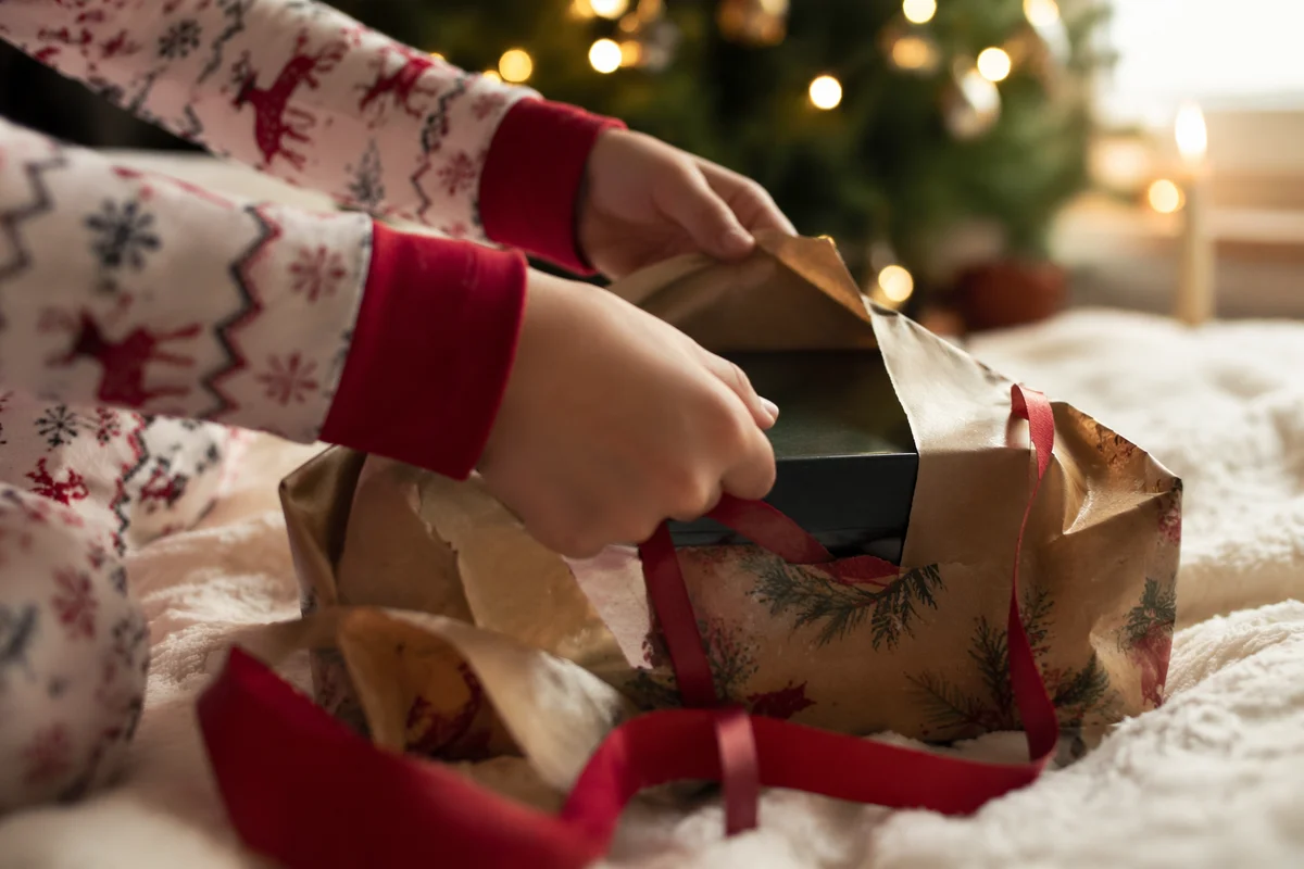 Christmas Morning Gift Unwrapping Close-Up
