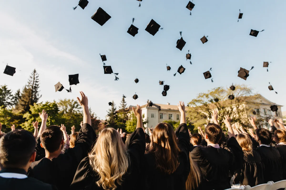 Graduation Caps Soaring Over Spring Campus