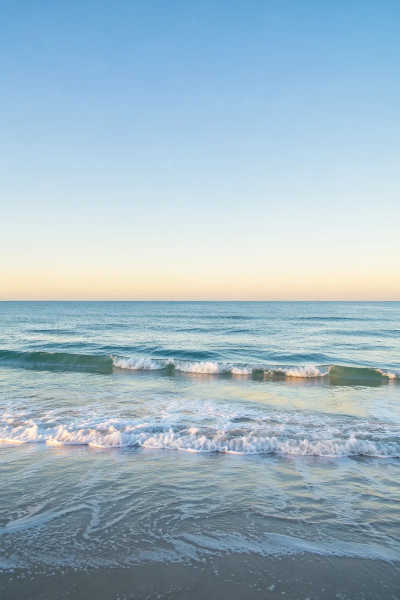 Calm Blue Ocean Waves at Sunrise
