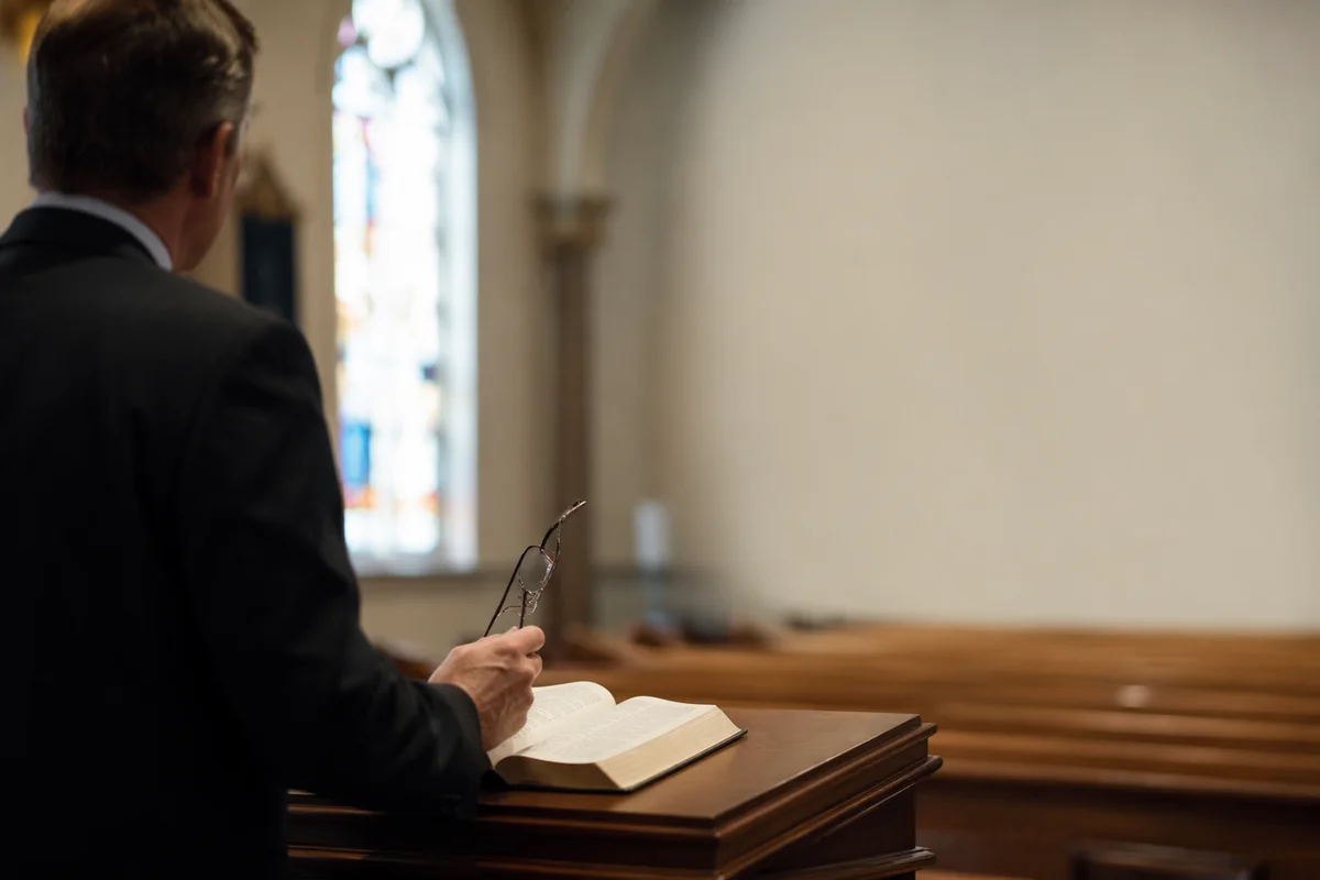 Pastor at Pulpit in Soft Chapel