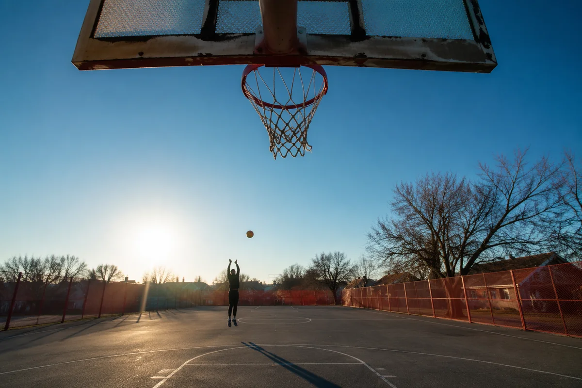 Sunny Neighborhood Basketball Court and Hoop