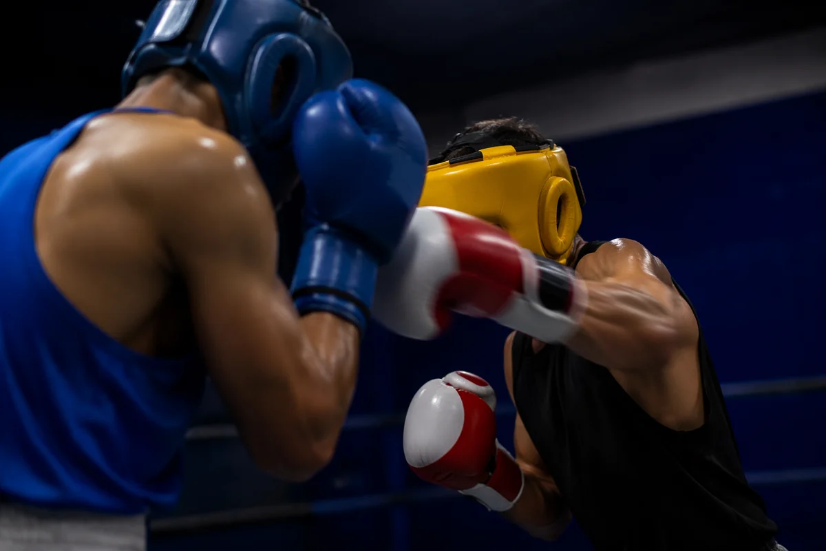 Intense Boxing Sparring in Gym Ring