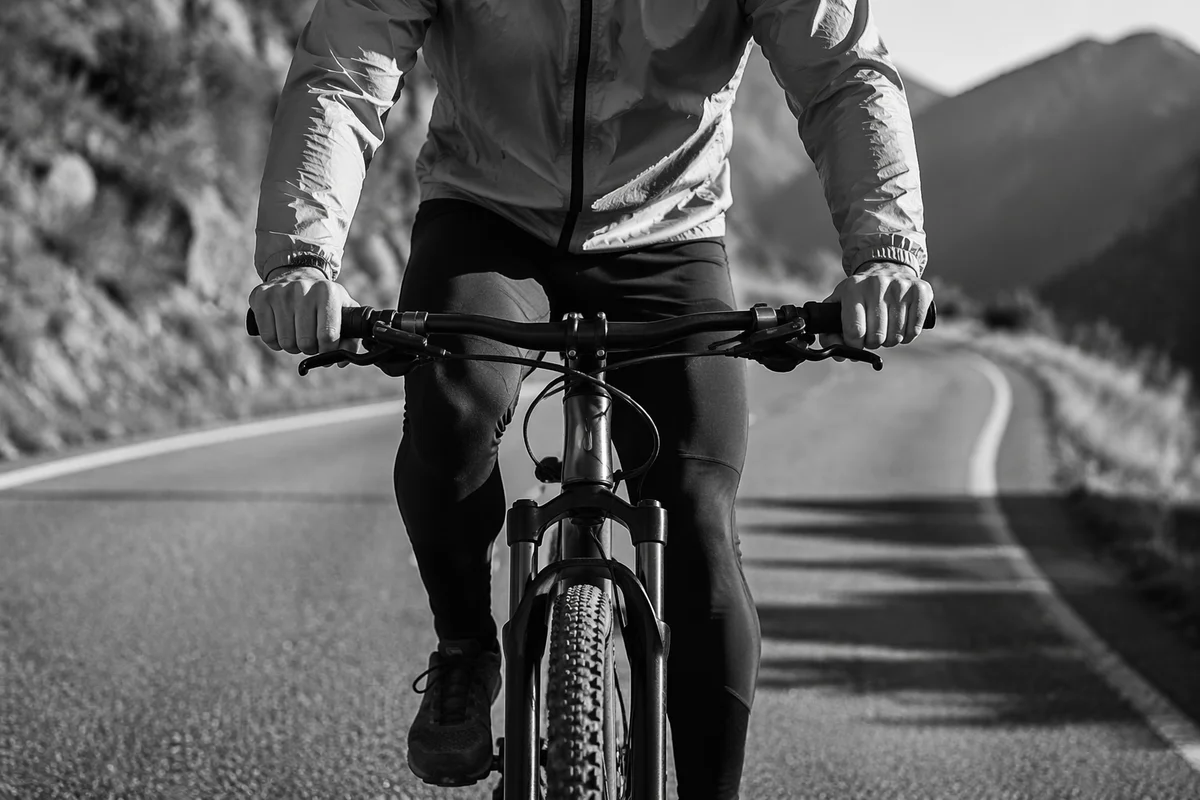 Cyclist Climbing Quiet Mountain Road