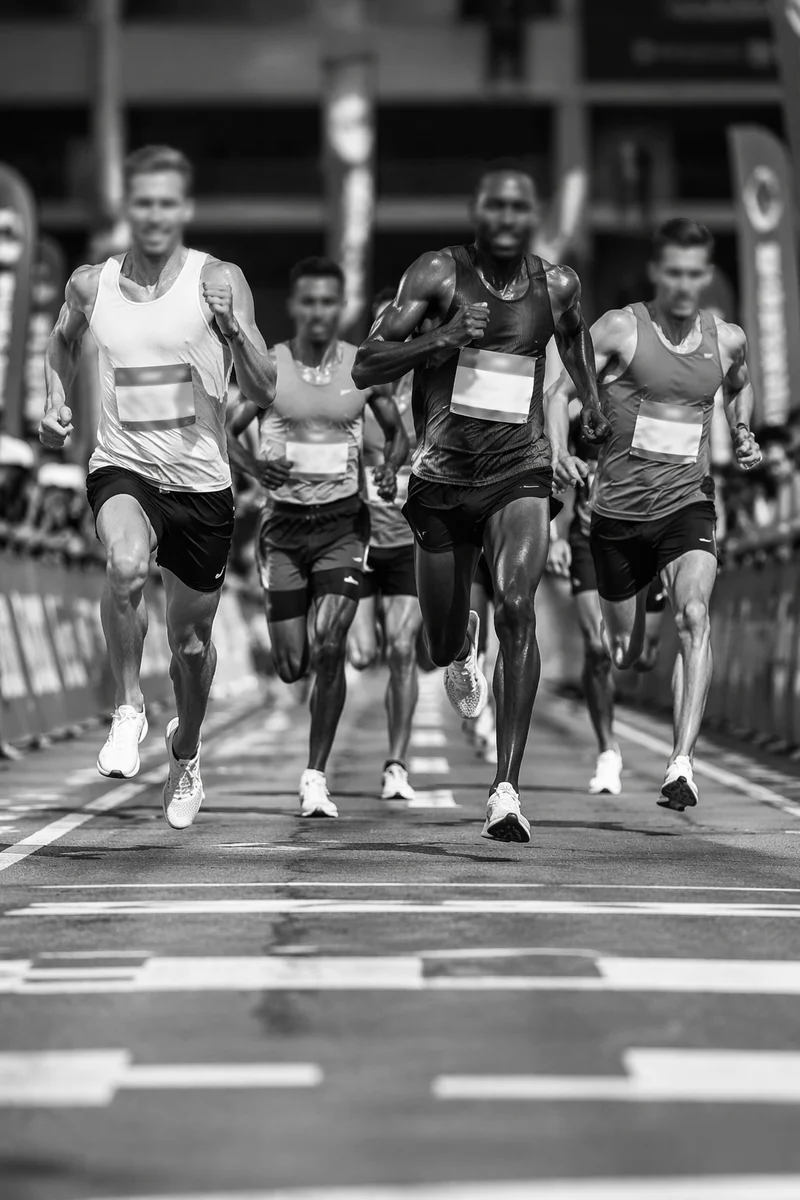 Marathon Runners Sprinting Toward Finish Line