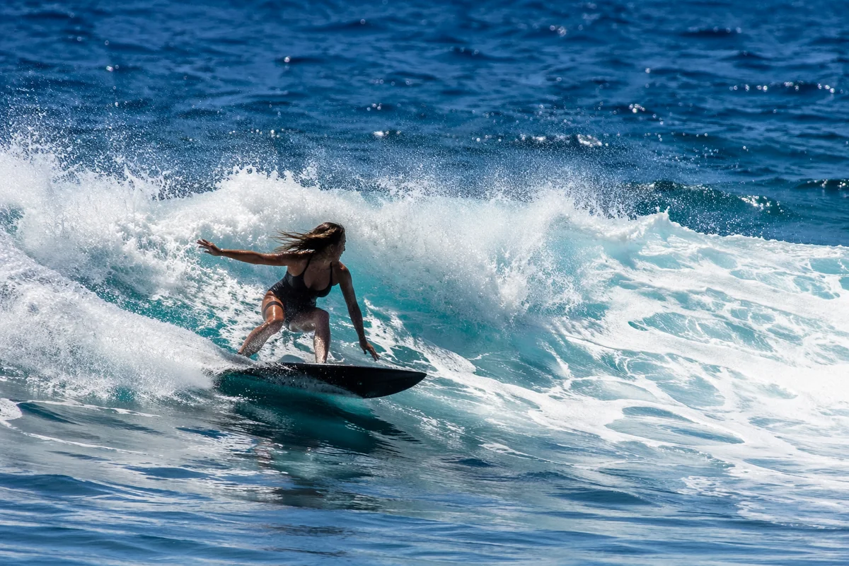 Surfer Riding Powerful Blue Ocean Wave