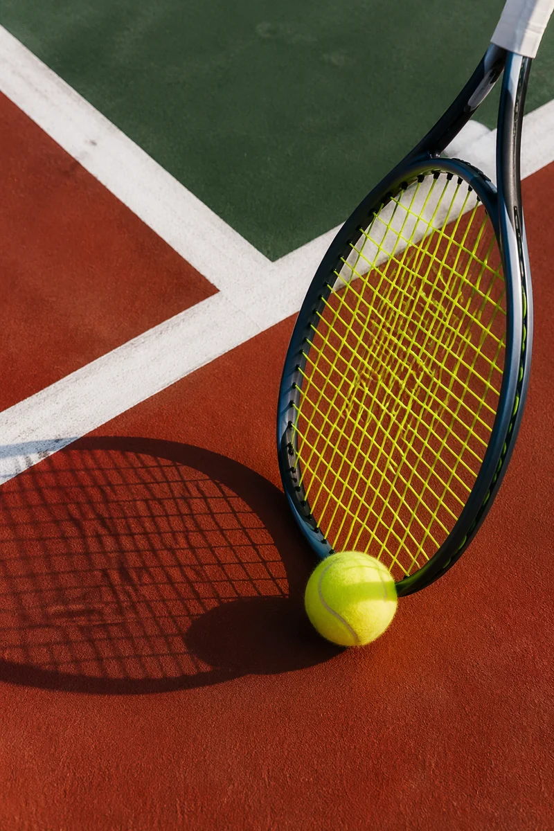 Tennis Racket and Ball on Court