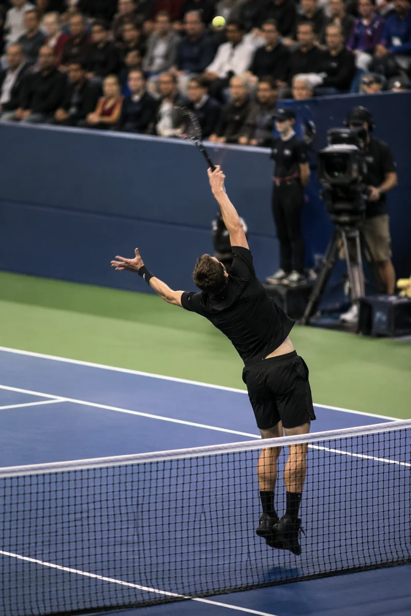 Indoor Tennis Serve on Blue Court