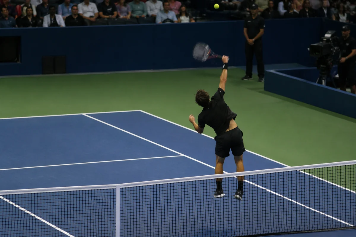 Indoor Tennis Serve on Blue Court