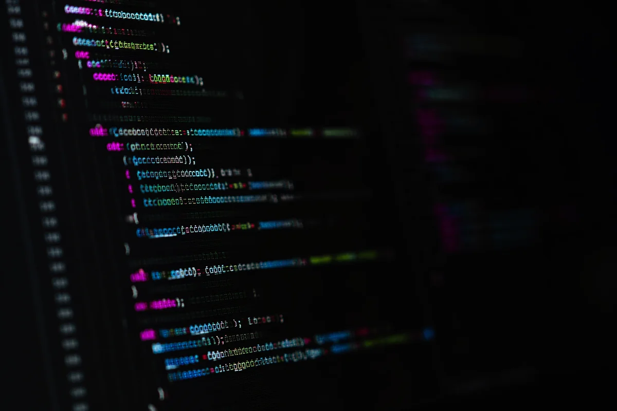Late Night Coding on Dark Monitor