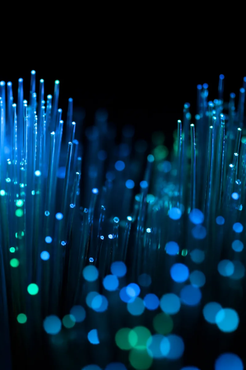 Glowing Fiber Optic Cables in Blue Light