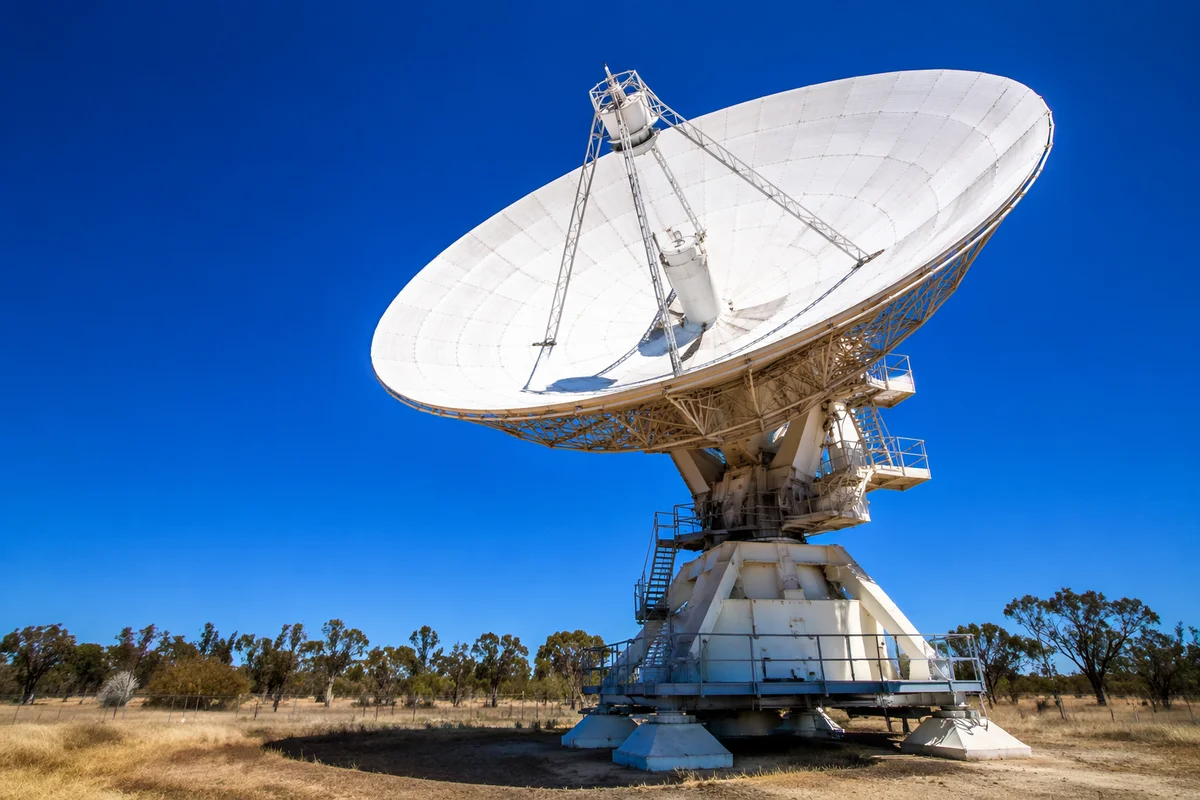 Satellite Communication Dish Under Blue Sky