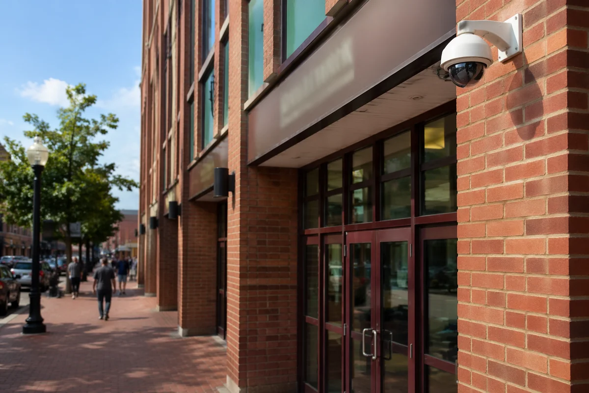 Dome Security Camera on Brick Building