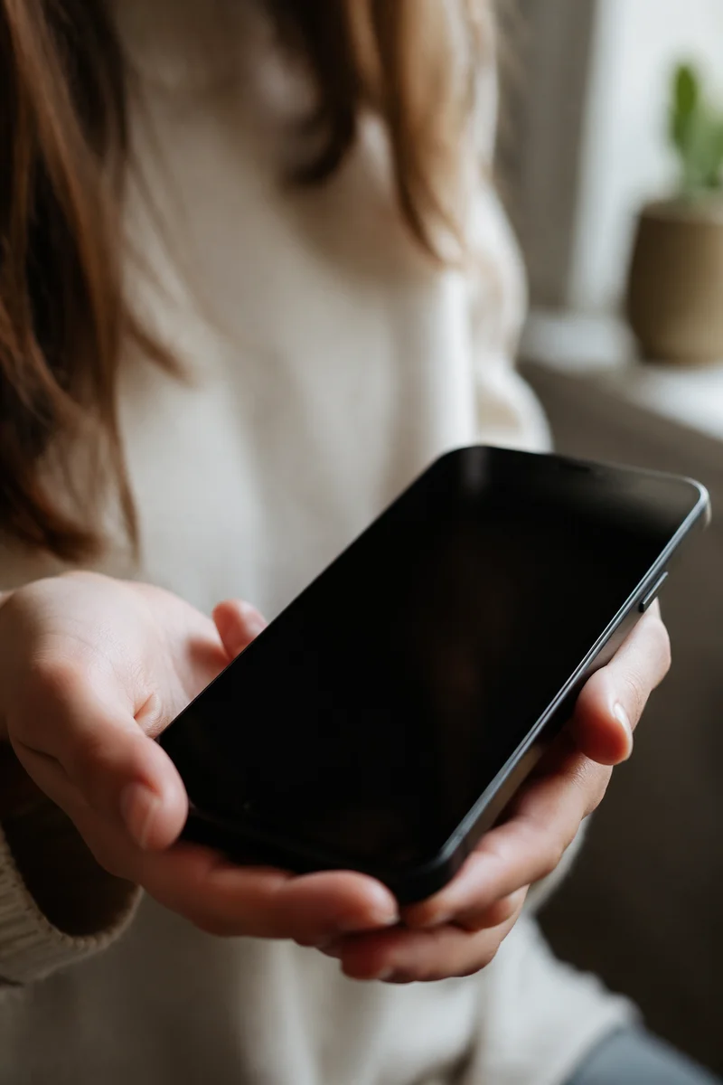 Hand Holding Black Smartphone Close Up