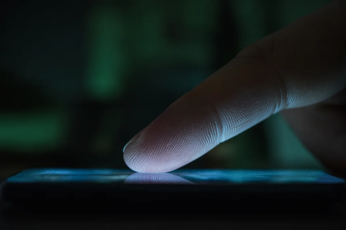 Finger Tapping Smartphone Screen Close Up