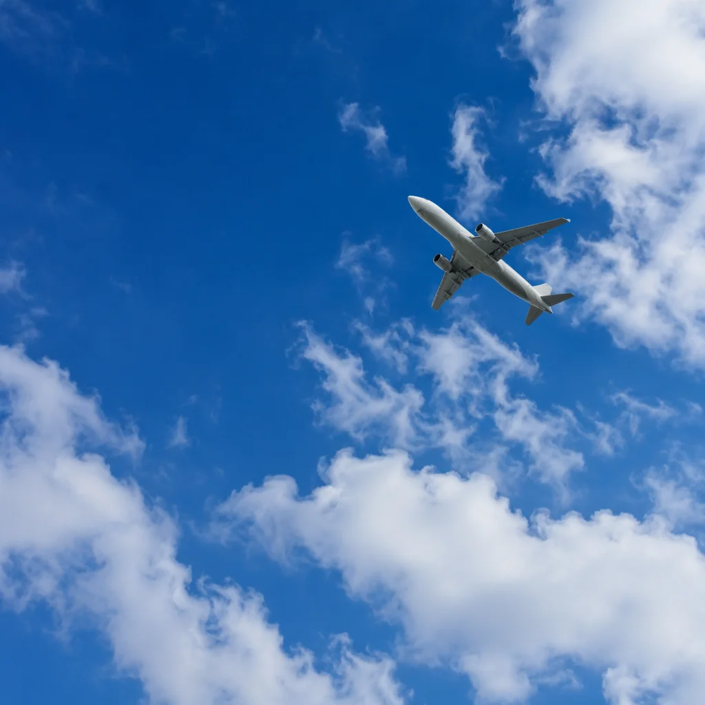 Passenger Airplane Crossing Blue Sky