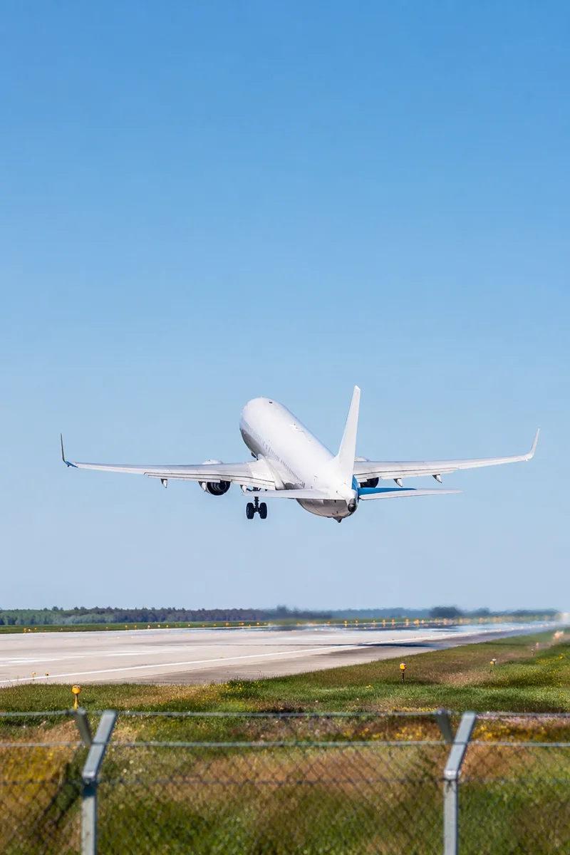 Passenger Airplane Taking Off Under Blue Sky