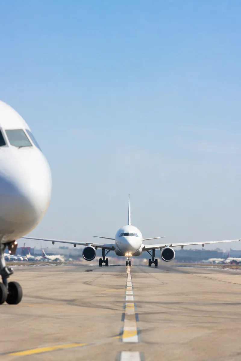 Commercial Airliner Taking Off Under Blue Sky