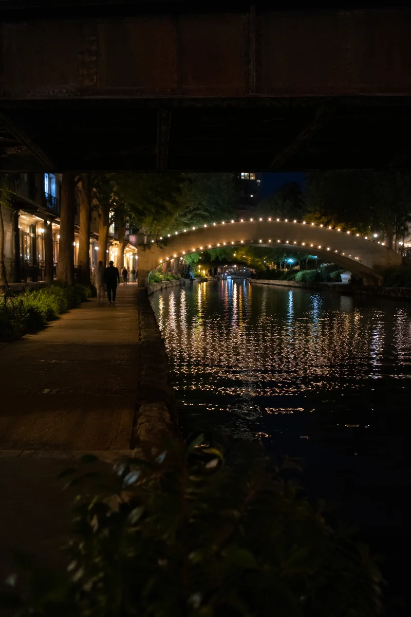 Glowing Bridge Over Quiet City River