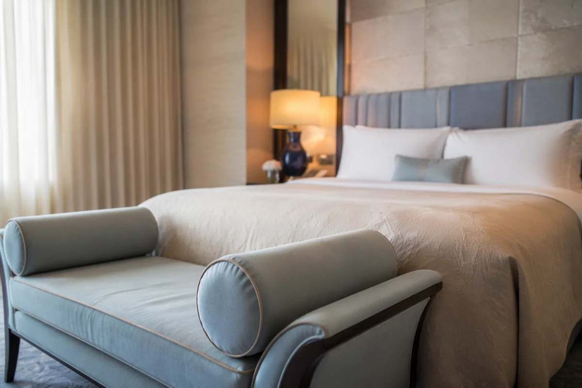Luxury Hotel Bed With Blue Bench