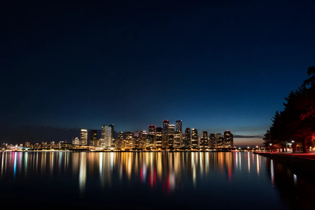 Modern Waterfront Skyline at Night Reflection