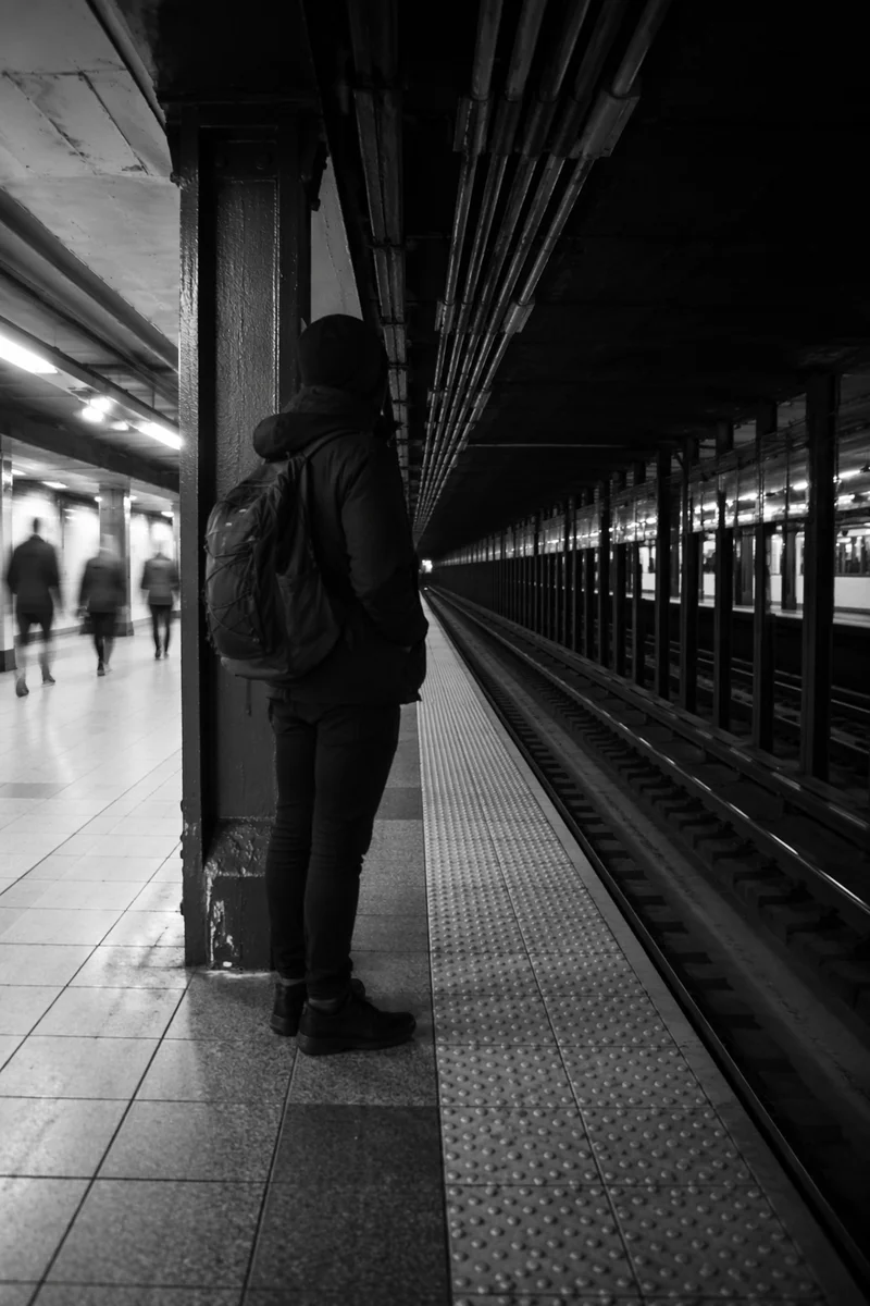 Solitary Traveler in Underground Metro Station
