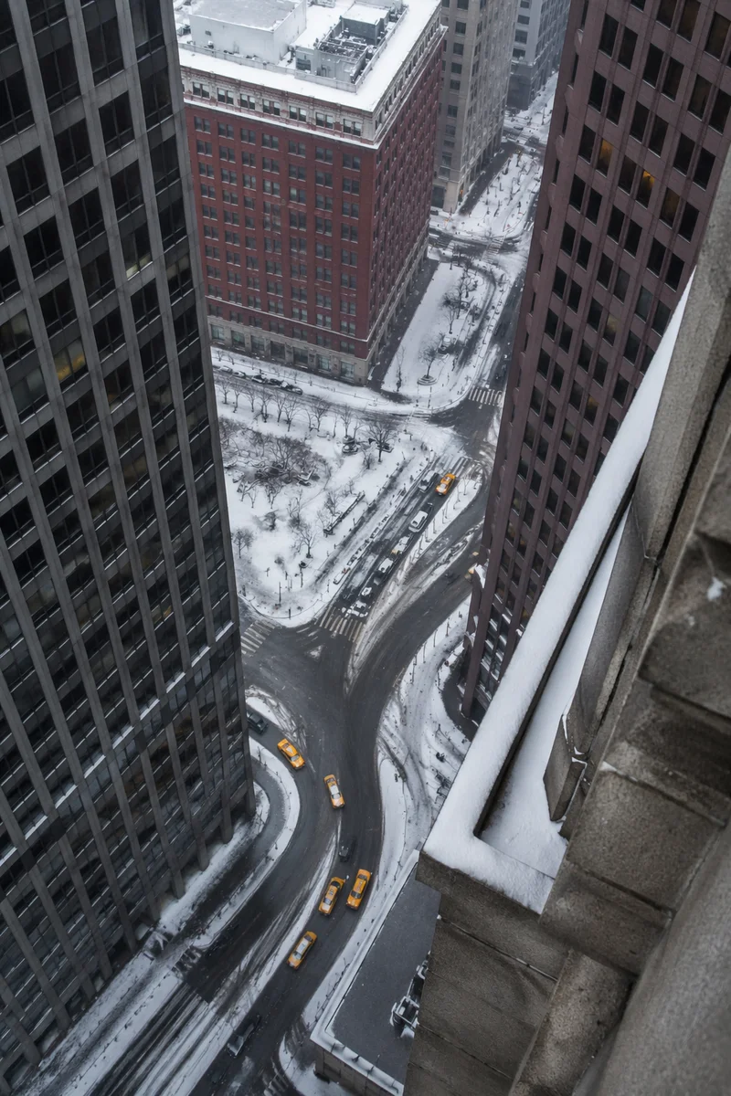 Yellow Taxis on Snowy Downtown Street