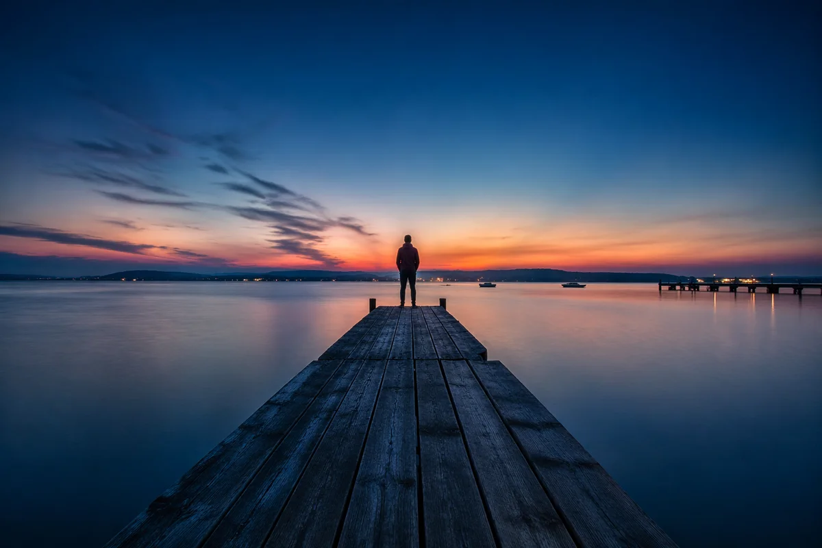 Twilight Wooden Dock on Calm Blue Lake