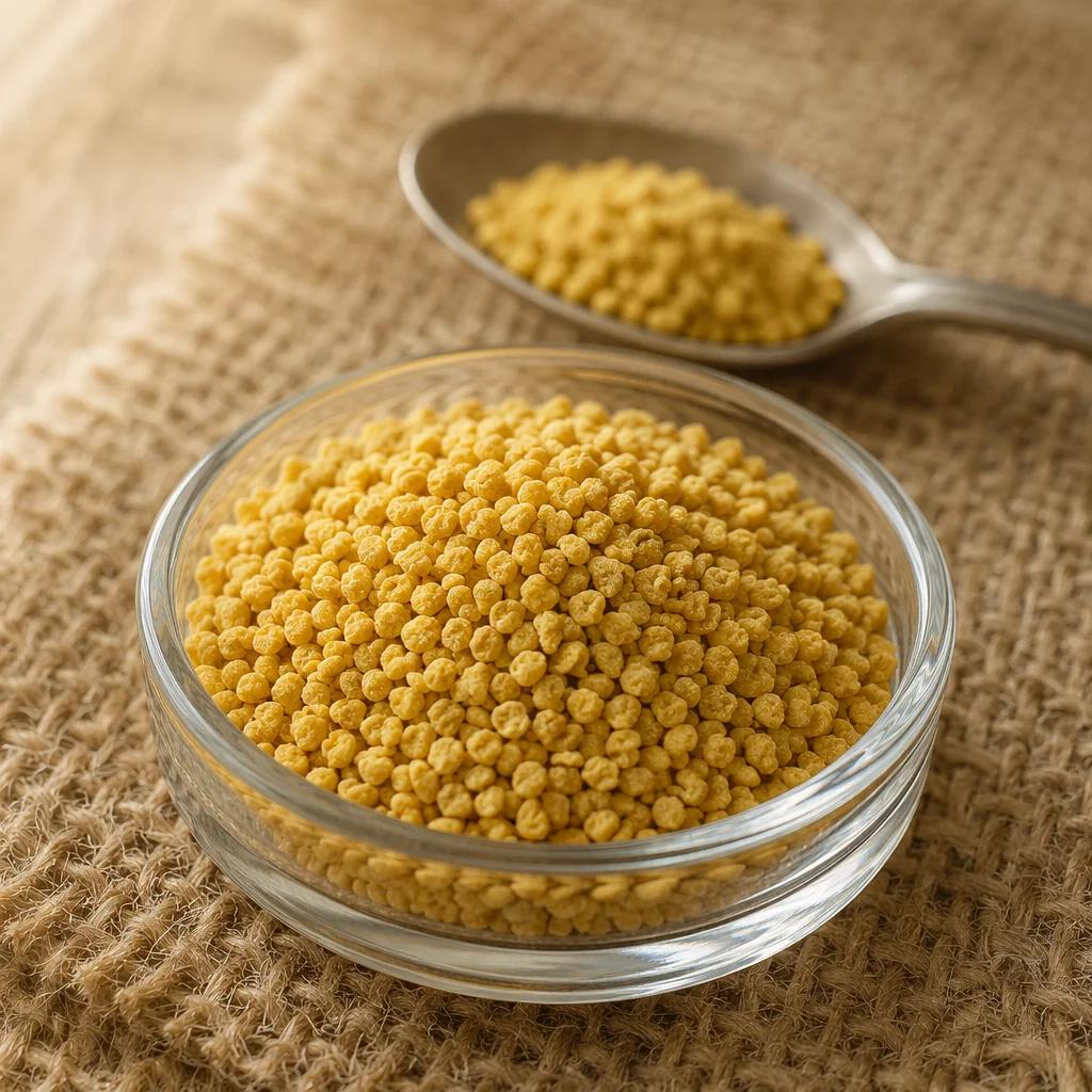Golden Vitamin Granules in Glass Dish