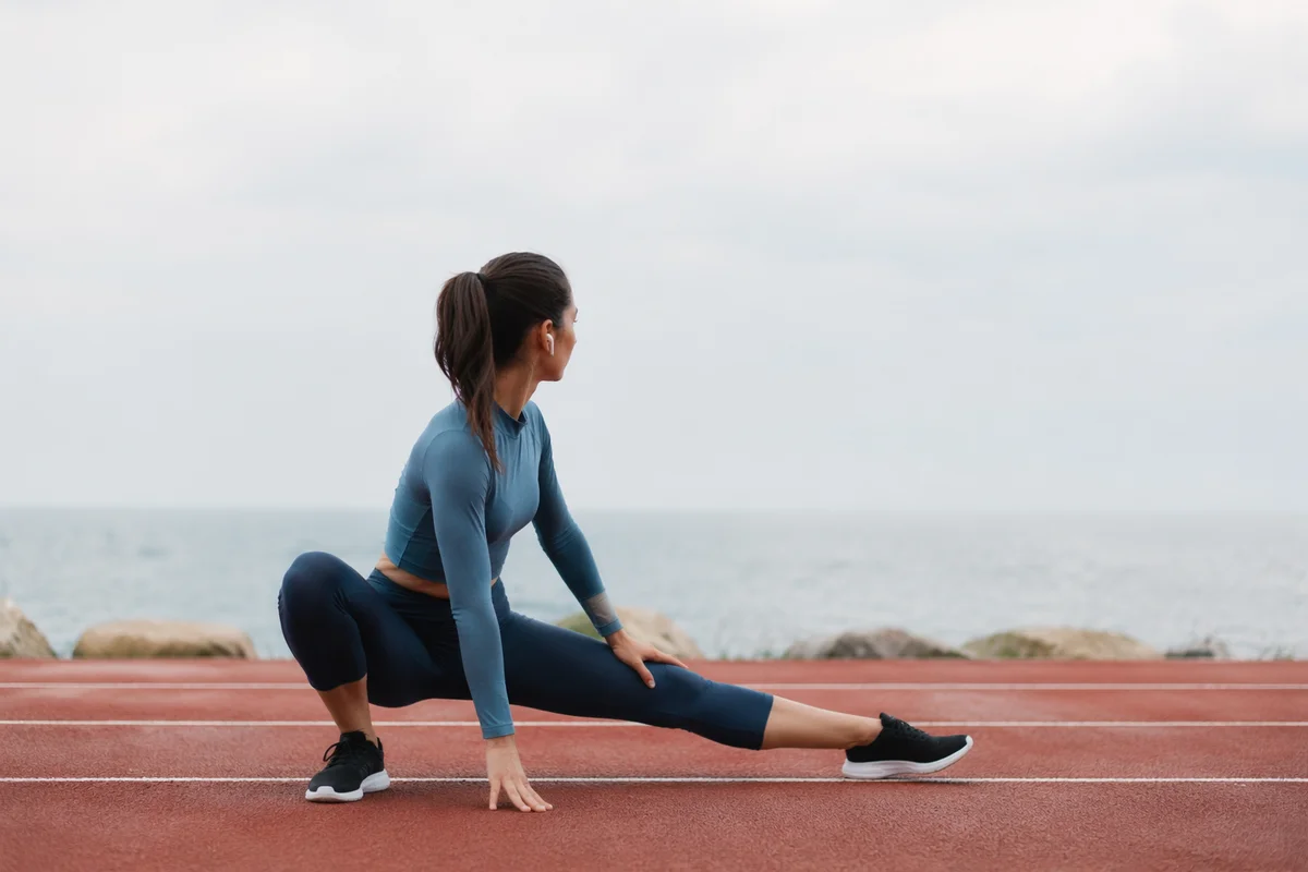 Focused Track Stretch Before Morning Run