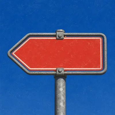 Red Left Arrow Sign Against Blue Sky