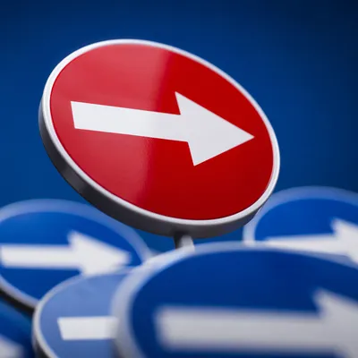 Red Arrow Direction Sign on Blue