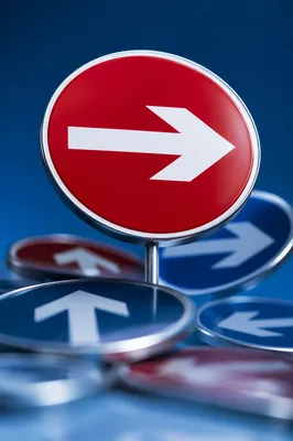 Red Arrow Direction Sign on Blue