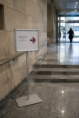 Red Arrow Direction Sign in Public Corridor