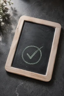 Green Chalk Checkmark on Slate Board