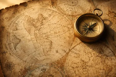Antique Compass on Sepia Navigation Map