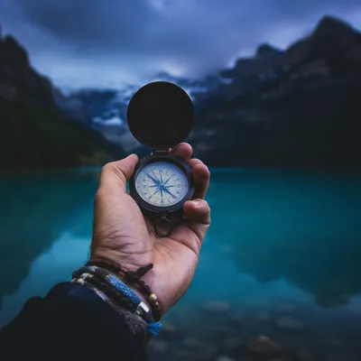 Compass in Hand by Twilight Mountain Lake