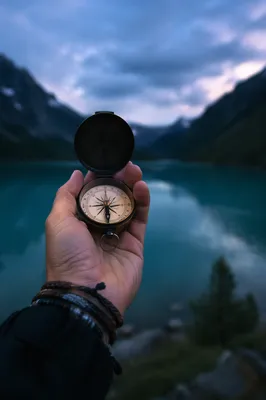 Compass in Hand by Twilight Mountain Lake