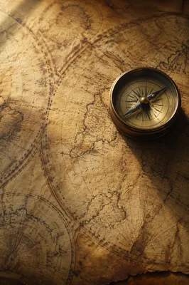 Antique Compass on Sepia Navigation Map
