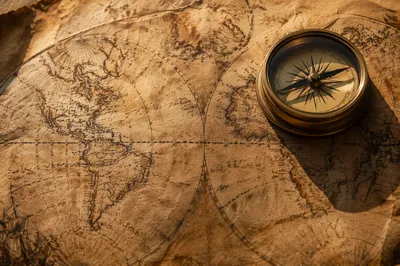 Antique Compass on Sepia Navigation Map