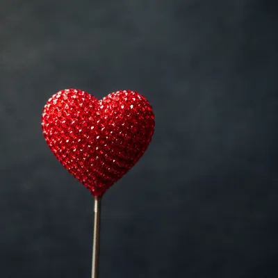 Red Heart Ornament on Dark Background
