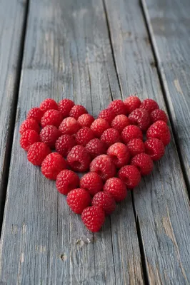 Red Raspberry Heart on Rustic Wood