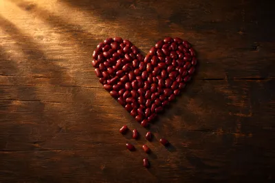Red Bean Heart on Rustic Wood