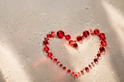 Translucent Red Glass Heart on Cream