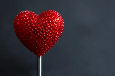 Photorealistic Red Heart Ornament on Dark Background