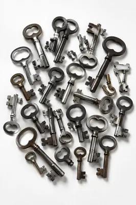 Vintage Metal Keys on White Surface