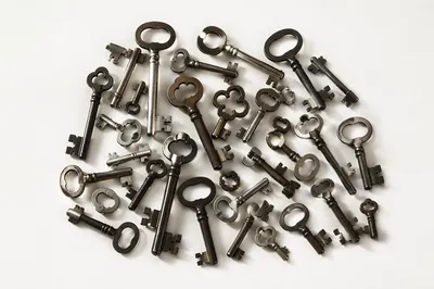 Vintage Metal Keys on White Surface