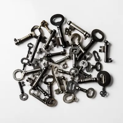 Vintage Metal Keys on White Surface