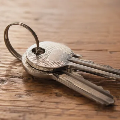 Silver Keys on Warm Wooden Table