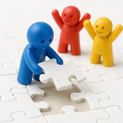 Teamwork Puzzle Figures Celebrating Final Piece